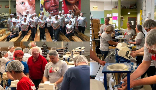 Employees volunteer at the Feed My Starving Children center in Schaumburg, Illinois.