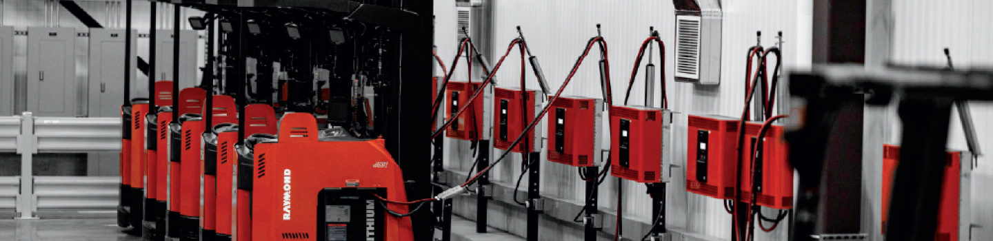 Lift trucks with lithium ion batteries connected to wall-mounted chargers