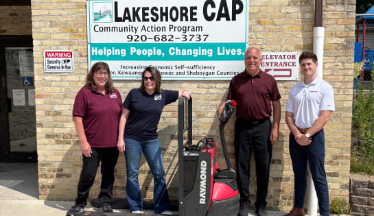 Associated and Lakeshore CAP employees with the donated pallet truck