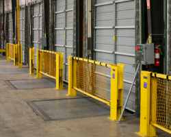 Yellow metal loading dock barriers.